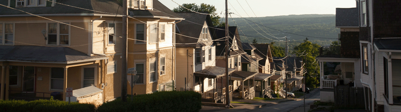 A row of houses in Collegetown, in Ithaca, NY as the run rises.